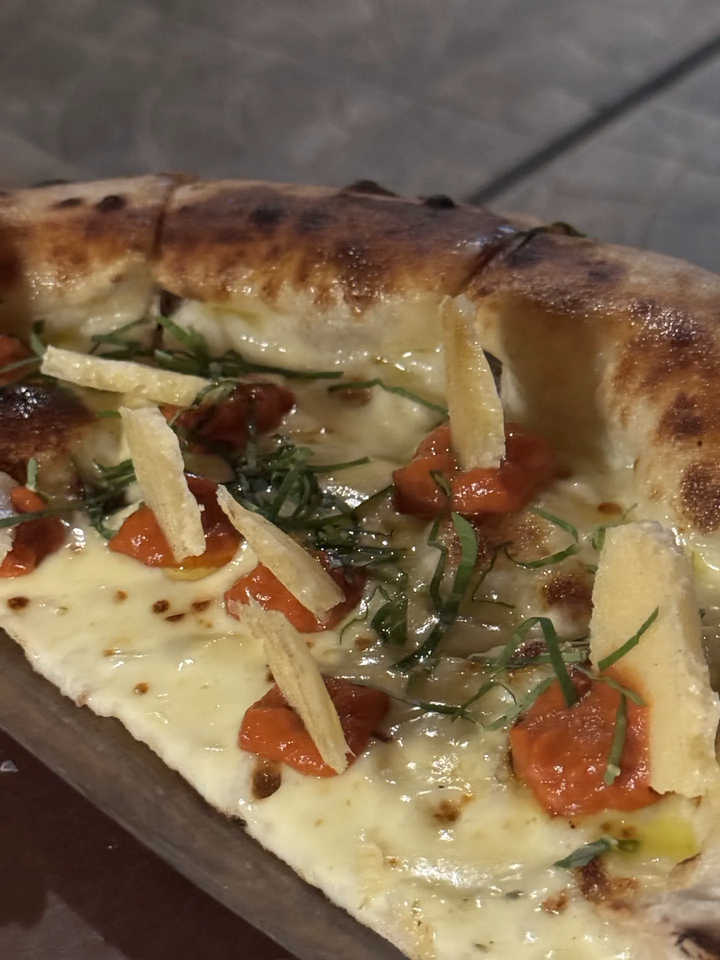 The pizza with that cheese-looking thing stuck in the tomato